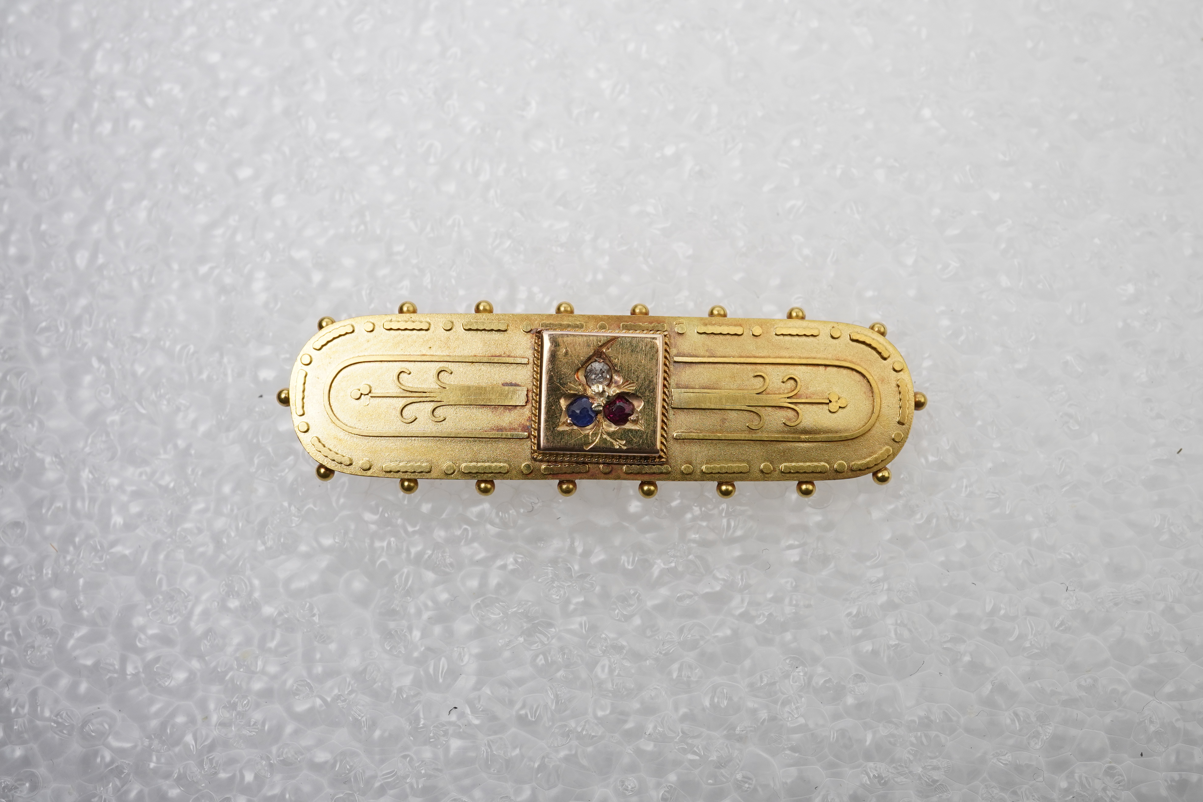 A Victorian gold, gem-set and diamond brooch, circa 1889